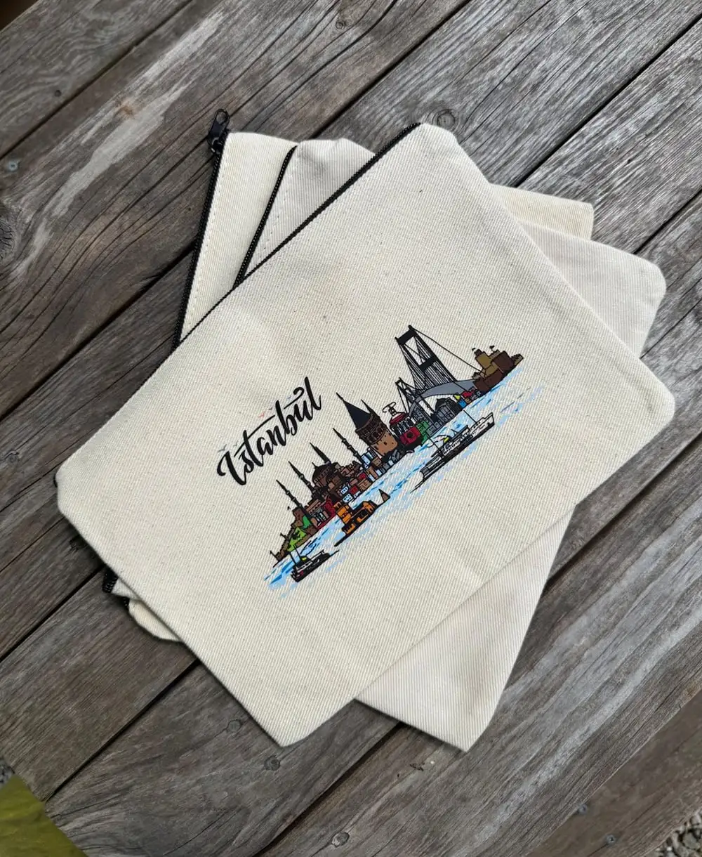 Istanbul Canvas Zipper Pouch: the Istanbul skyline and a ferry with “İstanbul” in script.