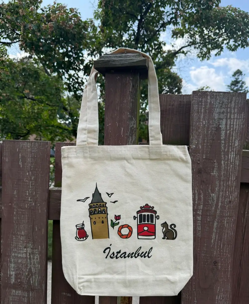 Istanbul Tote Bag: little drawings of Galata Tower, a tram, a simit and a cat.
